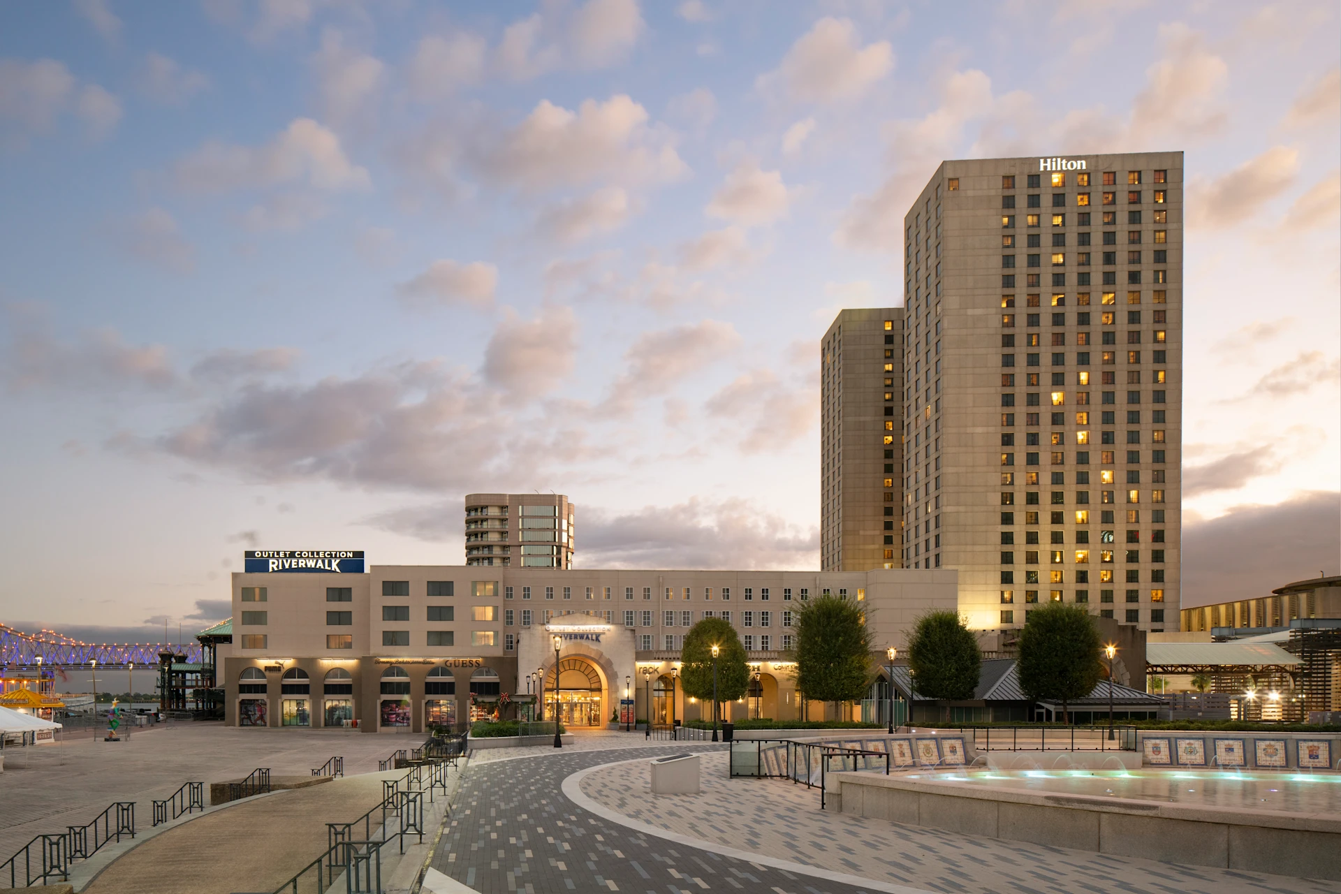 Hilton New Orleans Riverside exterior - a modern hotel tower on the Mississippi River waterfront